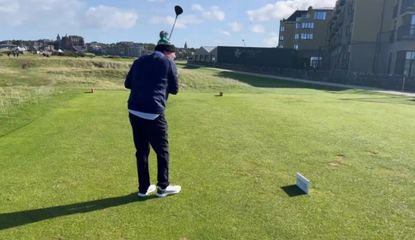 Morgan winces as he hits the Old Course Hotel