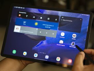The Samsung Galaxy Tab S7 FE in landscape mode, showing Android widgets