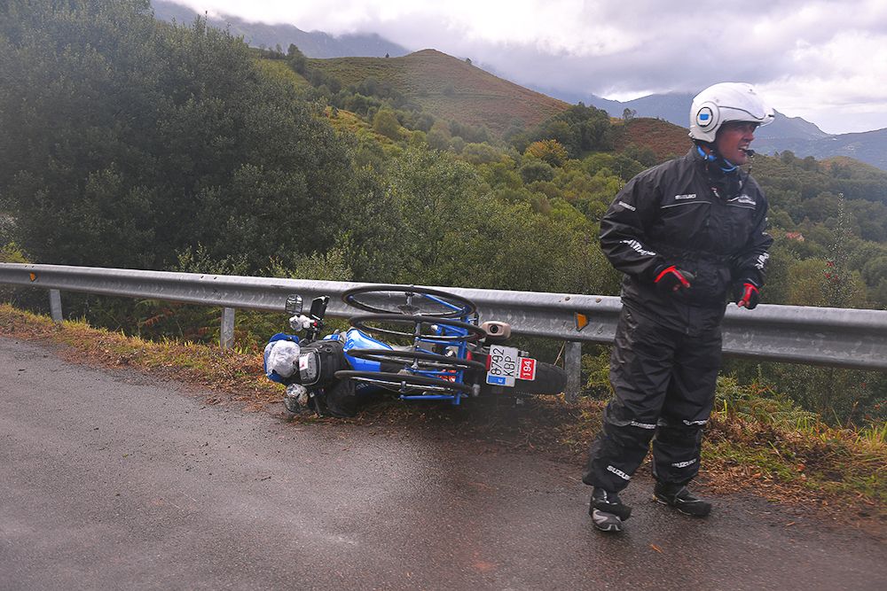 A crashed moto sits on the side of the road