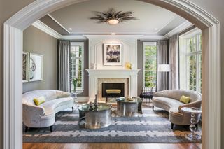 luxury living room ideas with arches and curved sofas by Viola Interior Design