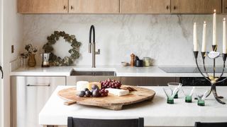 a kitchen with a christmas wreath