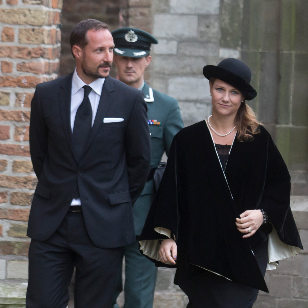 Crown Prince Haakon and Princess Martha Louise walking in black outfits
