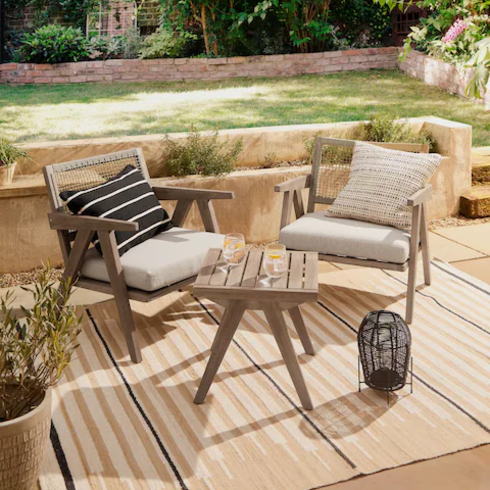 Next Natural Amalfi Garden Wooden 2 Seater Bistro Table and Chairs Set in a garden