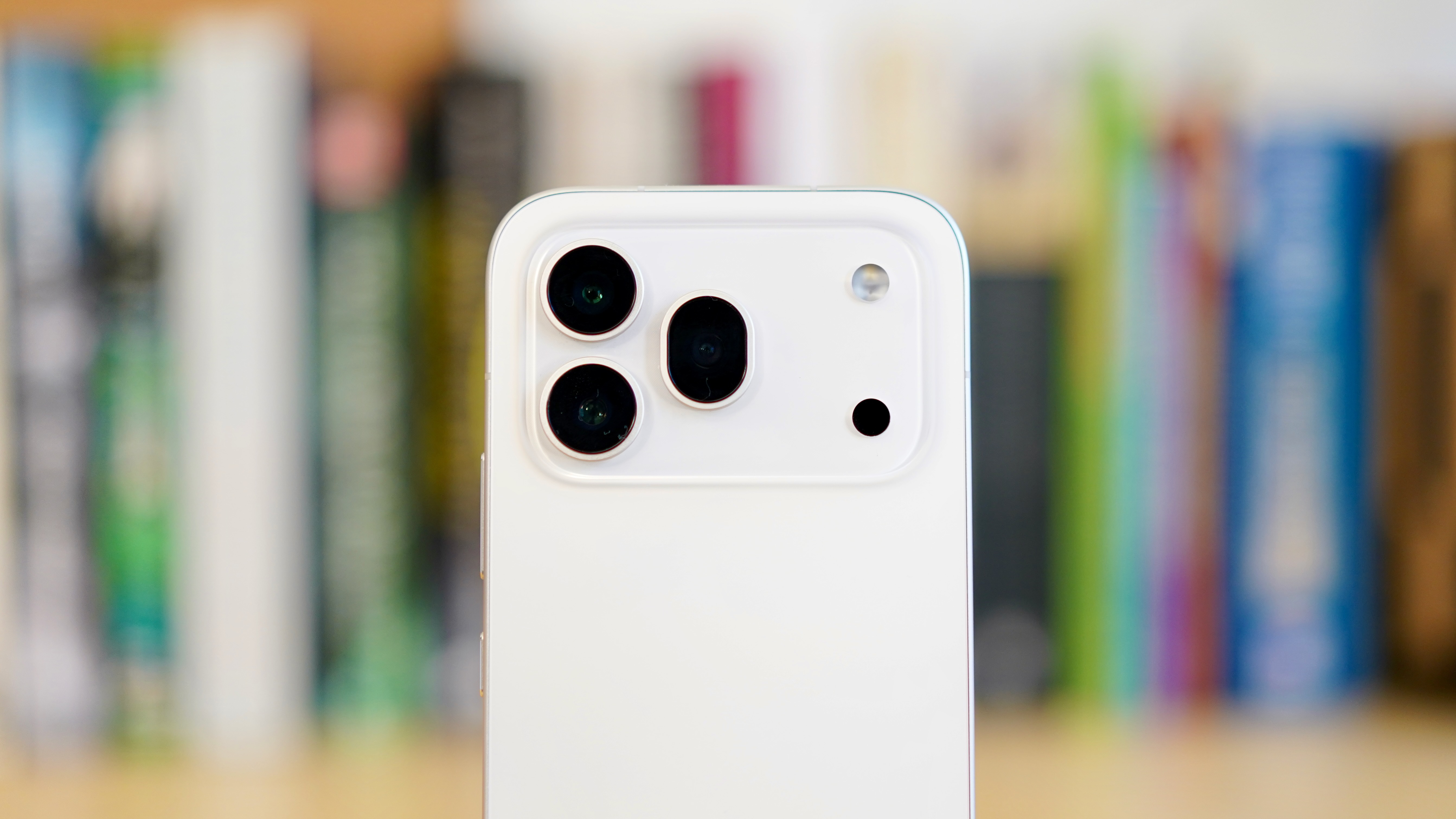 A white Honor 600 Pro resting on a wooden table