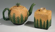 A Wedgwood pineapple-themed teapot and tea caddy.