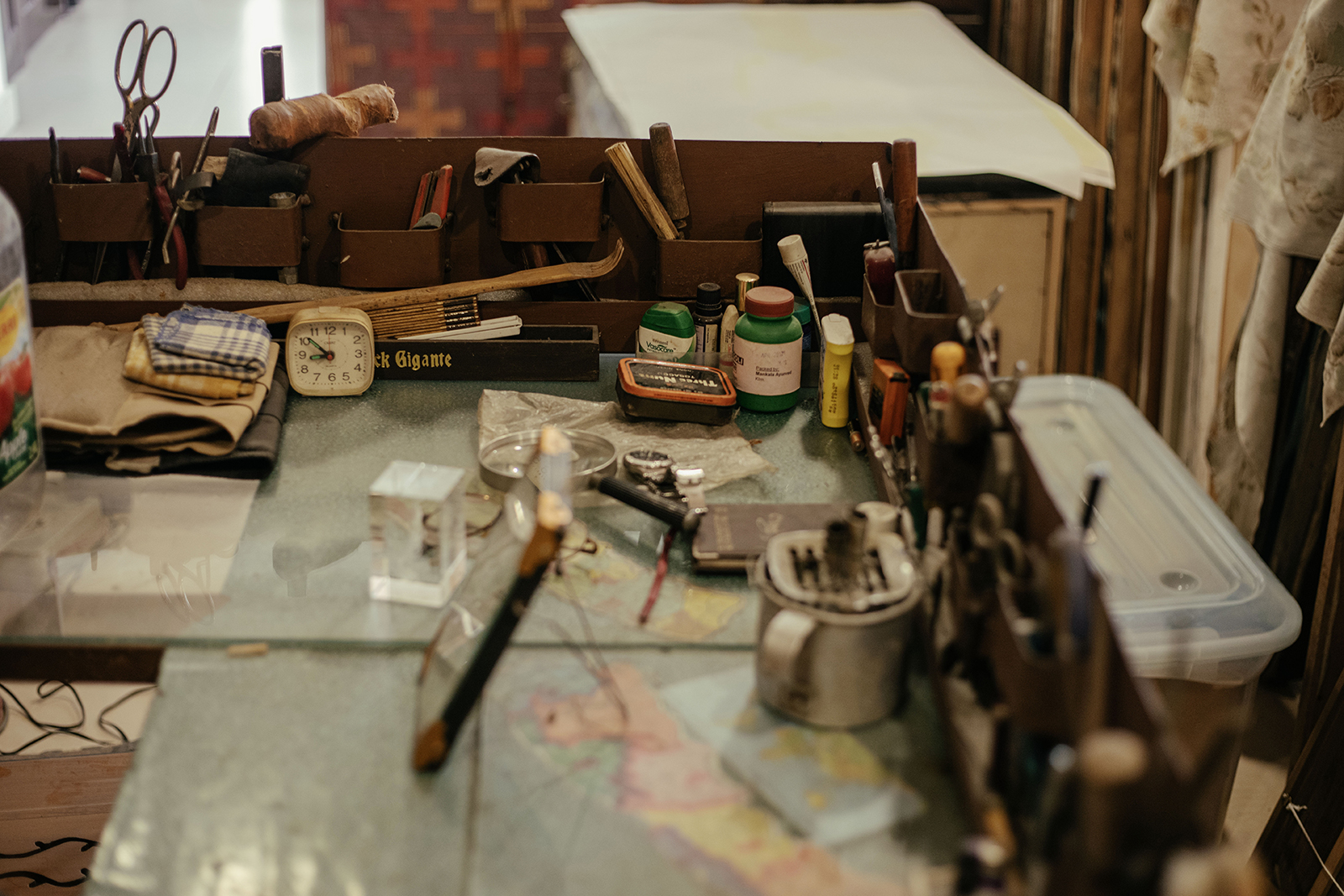 Manuj Babu Mishra&amp;rsquo;s studio, rich with full shelves, paintings, personal items and lots of colourful, lived-in decor