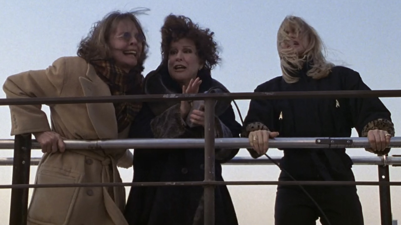 Annie, Brenda and Elise on the window washing scaffold in The First Wives Club