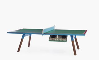 The table is available in both magneta and green