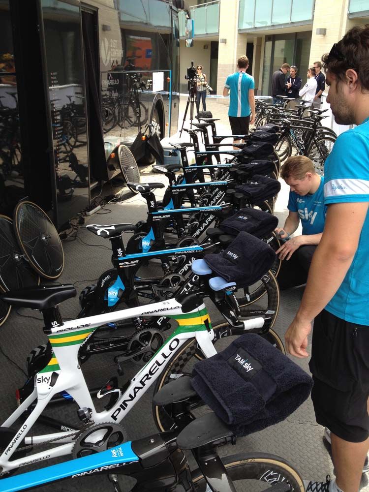 The Team Sky staff line-up the Pinarello bikes for the riders to do their warm-up routine