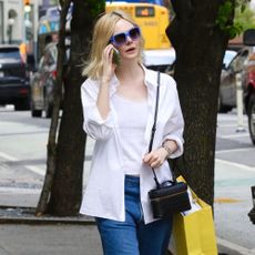 Ella Fanning wears Miu Miu sandals.