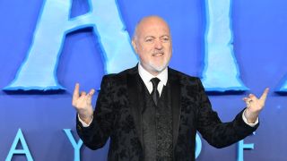 Bill Bailey throwing the metal horns
