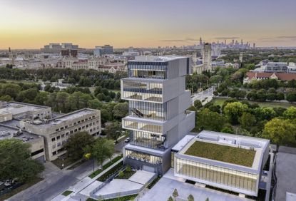 University of Chicago photographer from higher ground. Tall building, that looks like floors are stacked one on top of each other in a zig-zag pattern. Each floor has all-glass walls from one side that provide a panoramic view of the rest of the city.