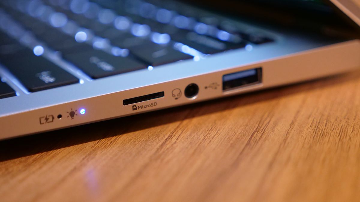Acer Swift 14 Go (2025) on a wooden tabletop.