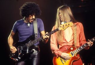 Phil Lynott and Scott Gorham onstage