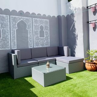 garden with wall painting and sofa