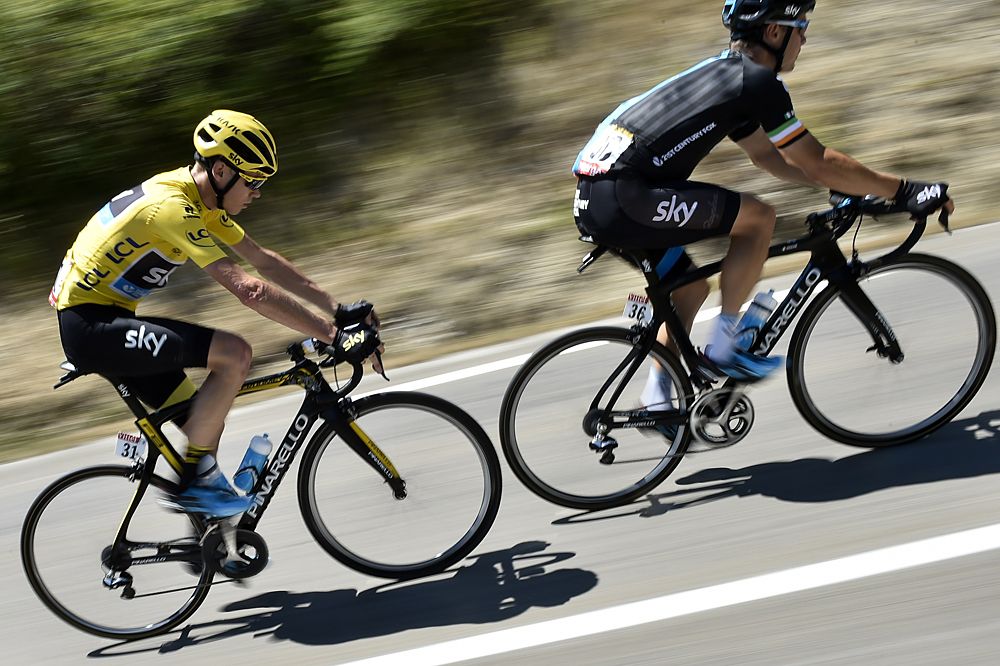 Team Sky lead overall leader Chris Froome on the road to Gap