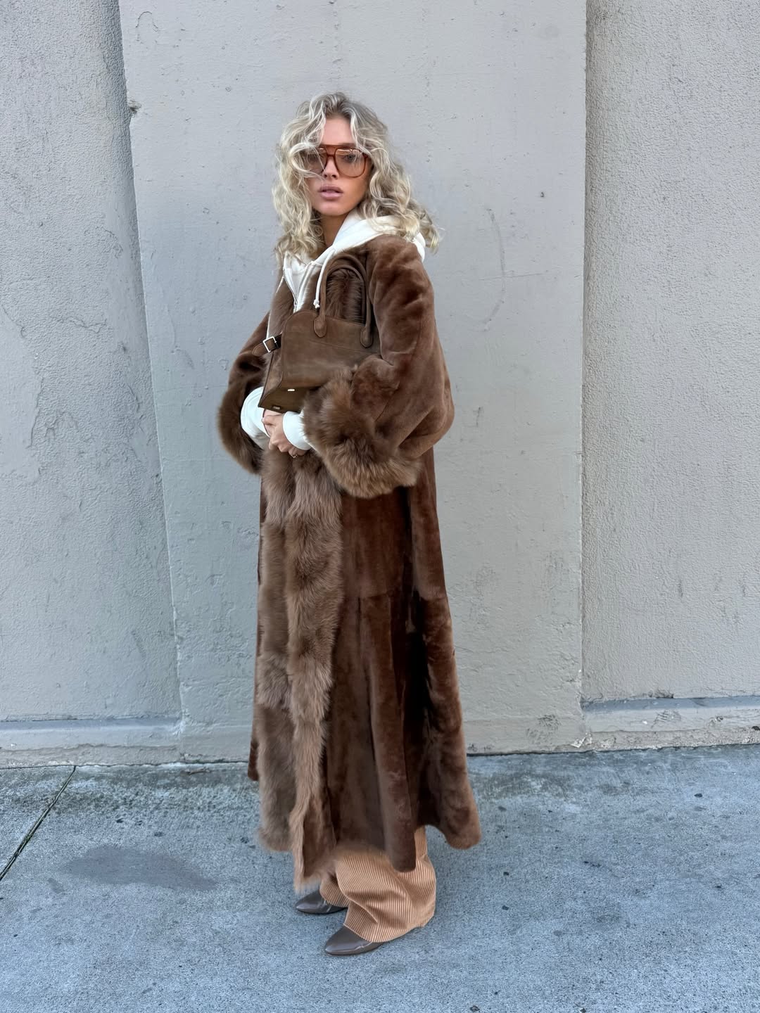 Elsa Hosk wearing a Nour Hammour shearling coat.