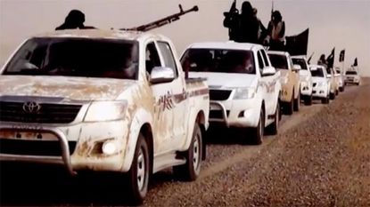 Islamic State fighters in Toyota trucks.