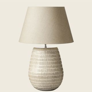 Taupe textured table lamp with a textured stone base