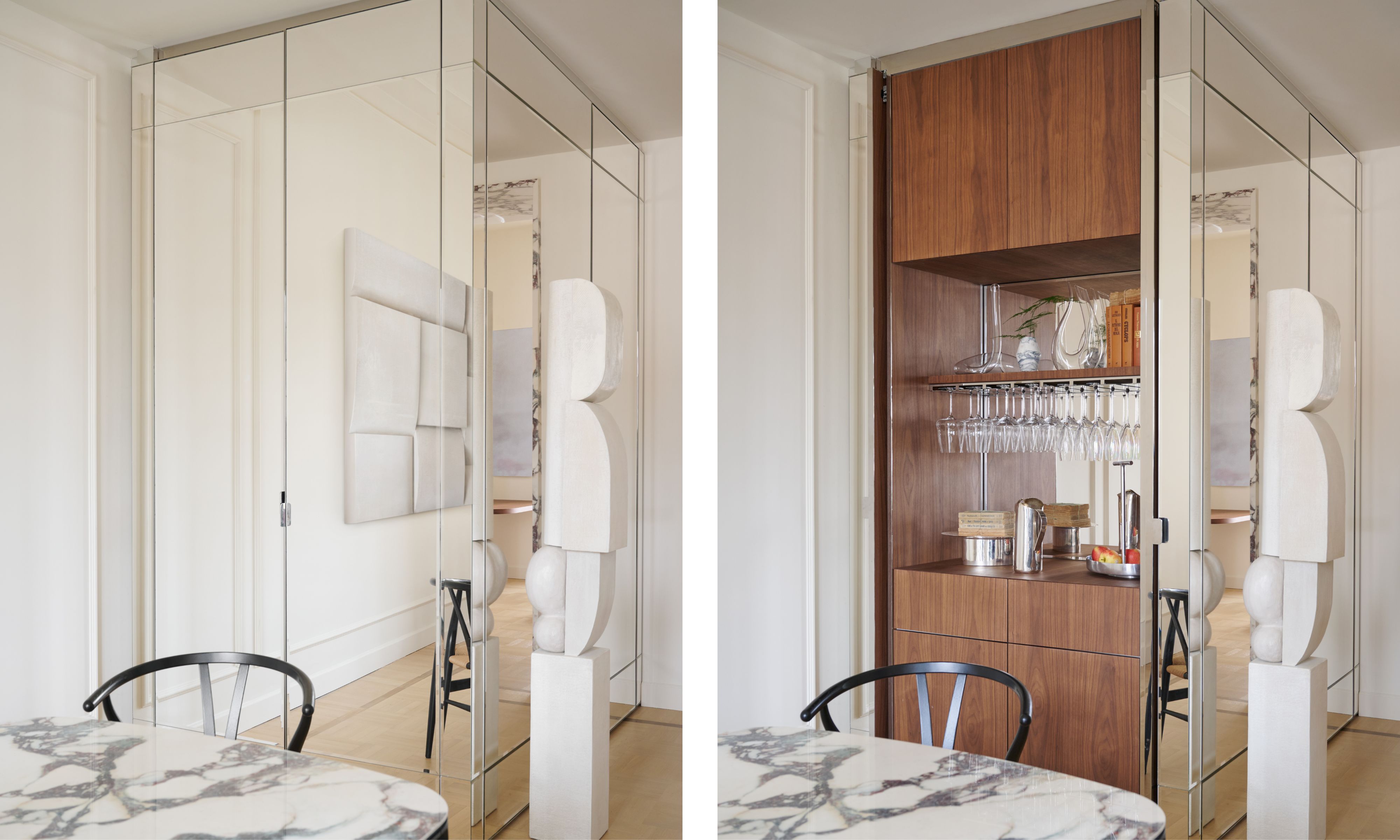 a walnut clad home bar concealed behind a mirrored door with a decorate sculptural object and a marble dining table and black chairs