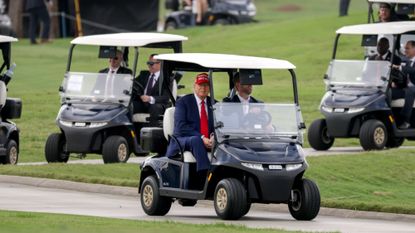 President Donald Trump rides in golf cart in Florida after shocking world with tariffs