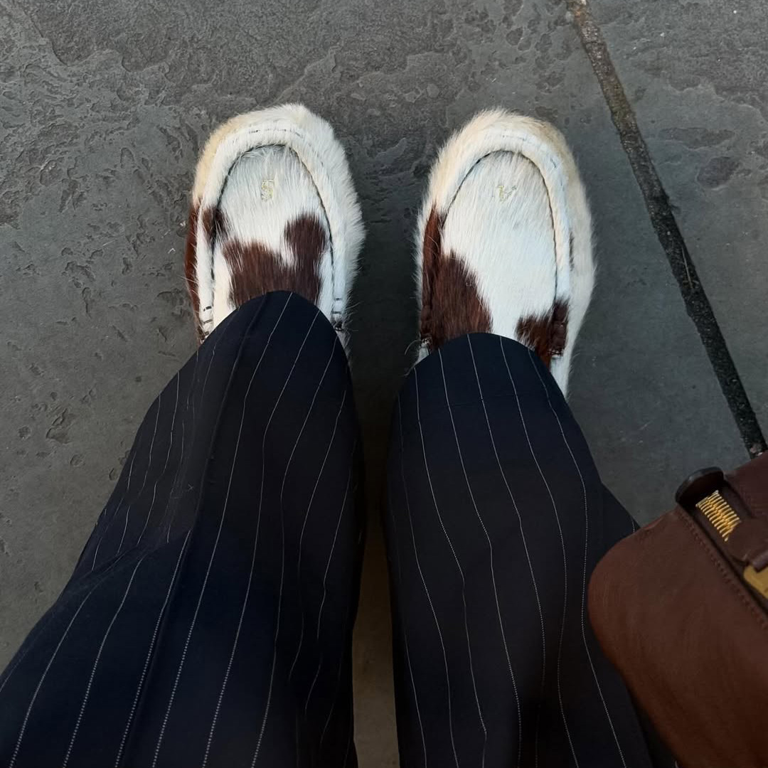 @rebeccaferrazwyatt in cow print shoes