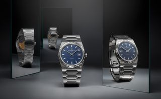 silver watch with blue dial