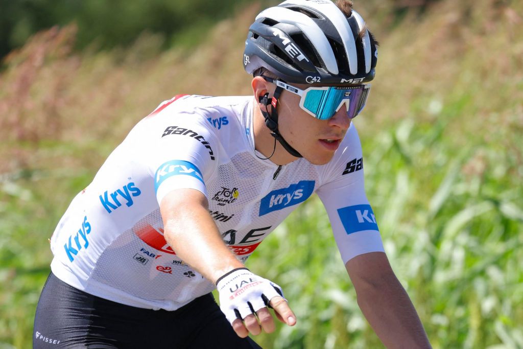 UAE Team Emirates' Slovenian rider Tadej Pogacar wearing the best young rider's white jersey cycles during the 13th stage of the 110th edition of the Tour de France cycling race, 138 km between Chatillon-sur-Chalaronne in central-eastern France and Grand Colombier, in the Jura mountains, in France, on July 14, 2023. (Photo by Thomas SAMSON / AFP)