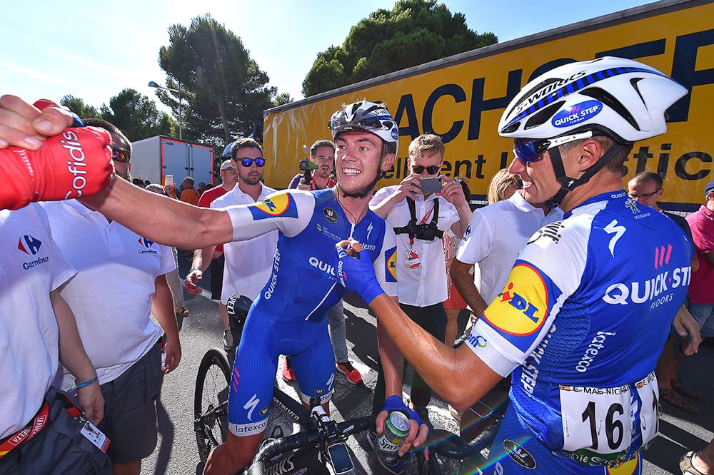 Enric Mas and Yves Lampaert celebrate the win
