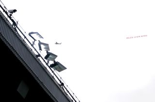 A banner reading ‘#Believe Kathryn Mayorga’ flies over Old Trafford