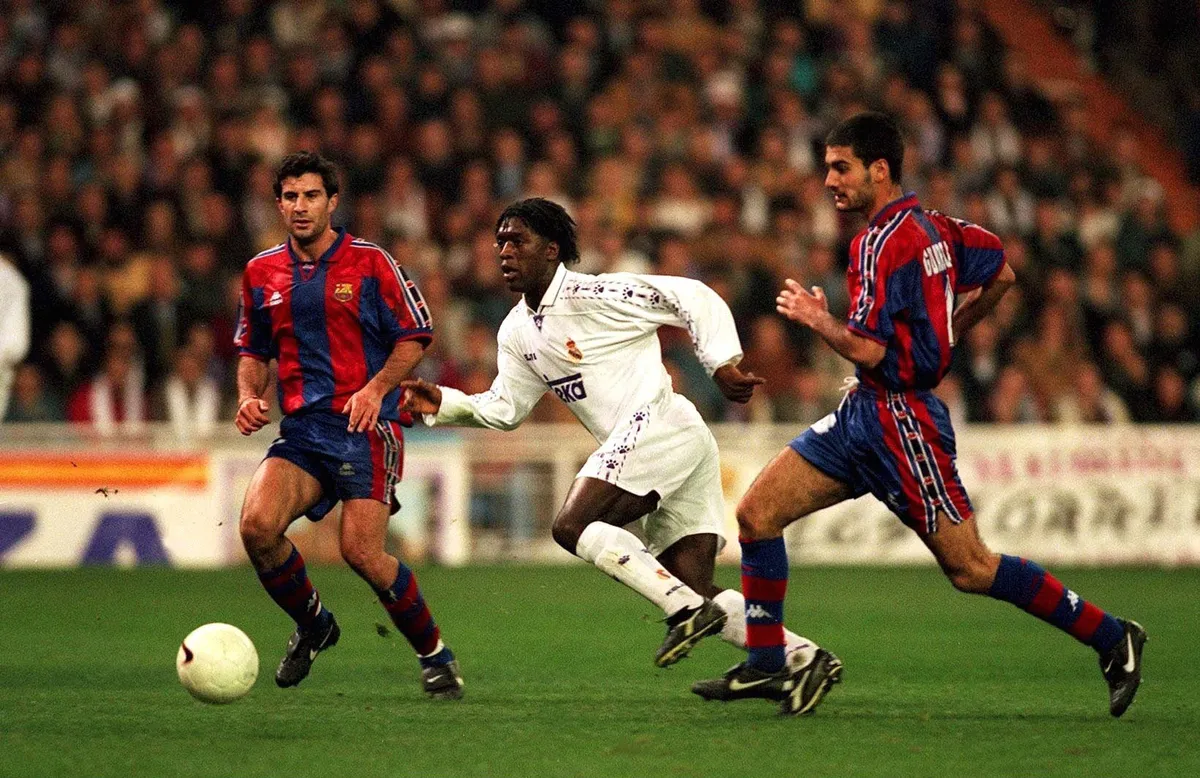 Real Madrid's Clarence Seedorf looks to get away from Barcelona pair Luis Figo and Pep Guardiola in a Clasico chash in 1997.