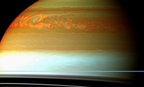 The colored swirls indicate the tail end of Saturn&amp;#039;s massive storm that occurred sometime between 2010 and 2011.