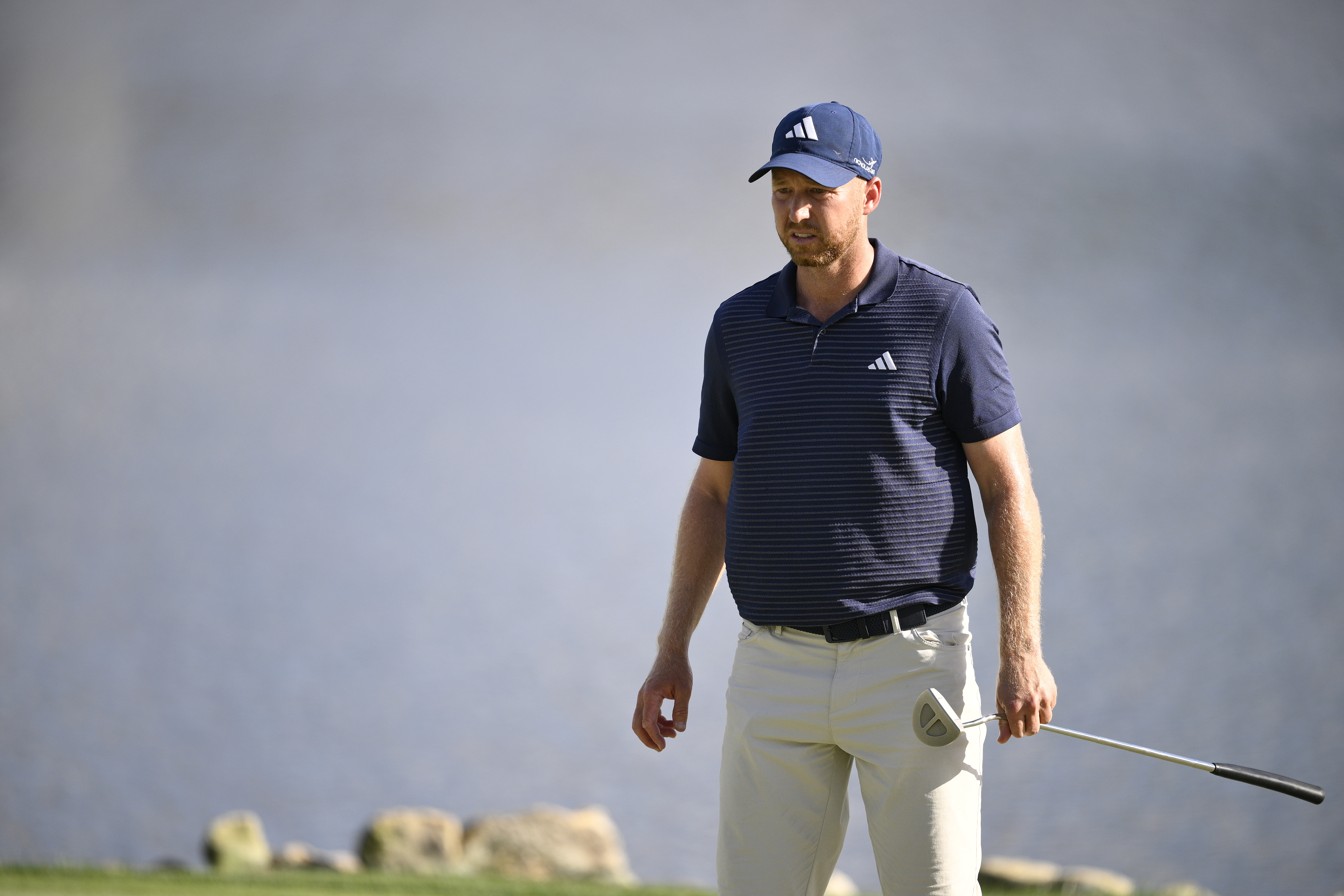 Daniel Berger lines up a putt