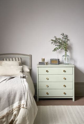 A dresser painted in a mint green paint