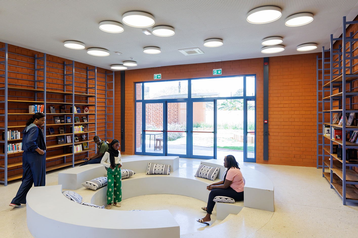 Goethe-Institut Dakar, brown earth block forms with wavy roofs designed by Francis Kere