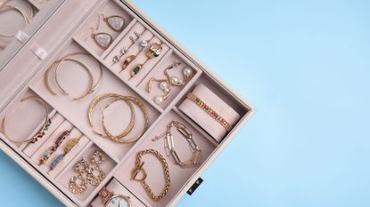 Stock photo of jewelry box with earrings, bracelets, rings, necklaces