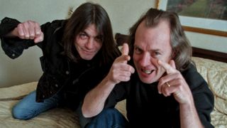 Angus and Malcolm Young of AC/DC hamming it up in hotel room in 2010