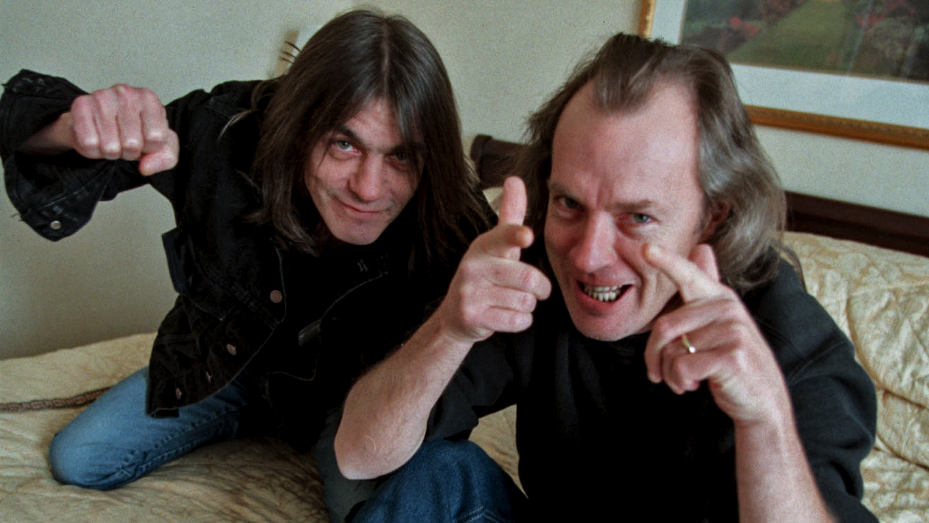 Angus and Malcolm Young of AC/DC hamming it up in hotel room in 2010