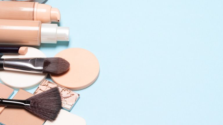 A selection of makeup brushes powders and foundations