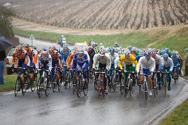 The peloton with yellow jacket Thor Hushovd in the middle is riding up an incline. Any uphill was appreciated as it offered a chance to get the body warm.