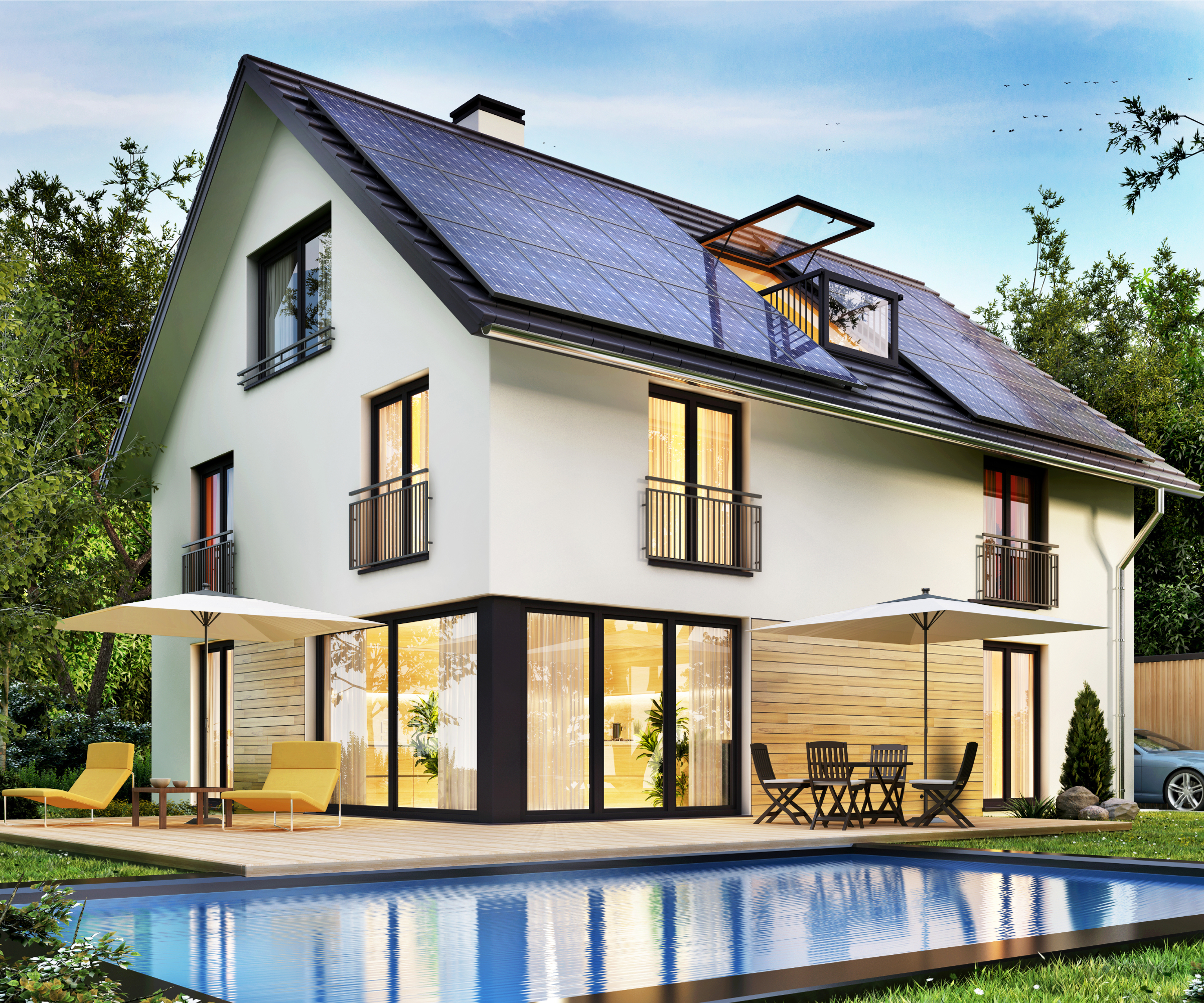 modern large detached house with solar panels on roof and outdoor swimming pool in garden