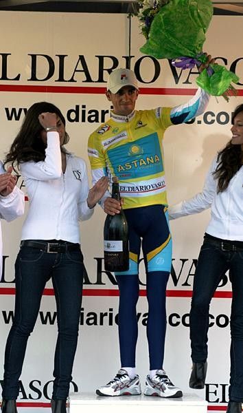 Contador receives another yellow jersey and lots of liquids.