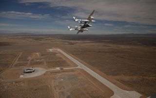 Early flyover of New Mexico's Spaceport America by the WhiteKnightTwo/SpaceShipTwo launch system.
