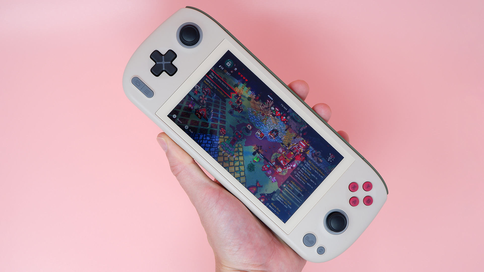 Ayaneo Air 1S handheld gaming PC on a pink background.