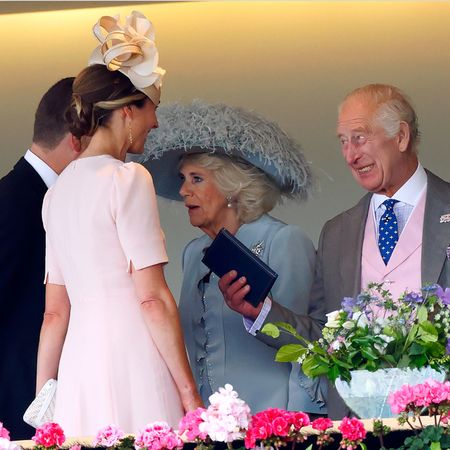 King Charles and Queen Camilla talking to Harriet Sperling and Peter Phillips at Ascot