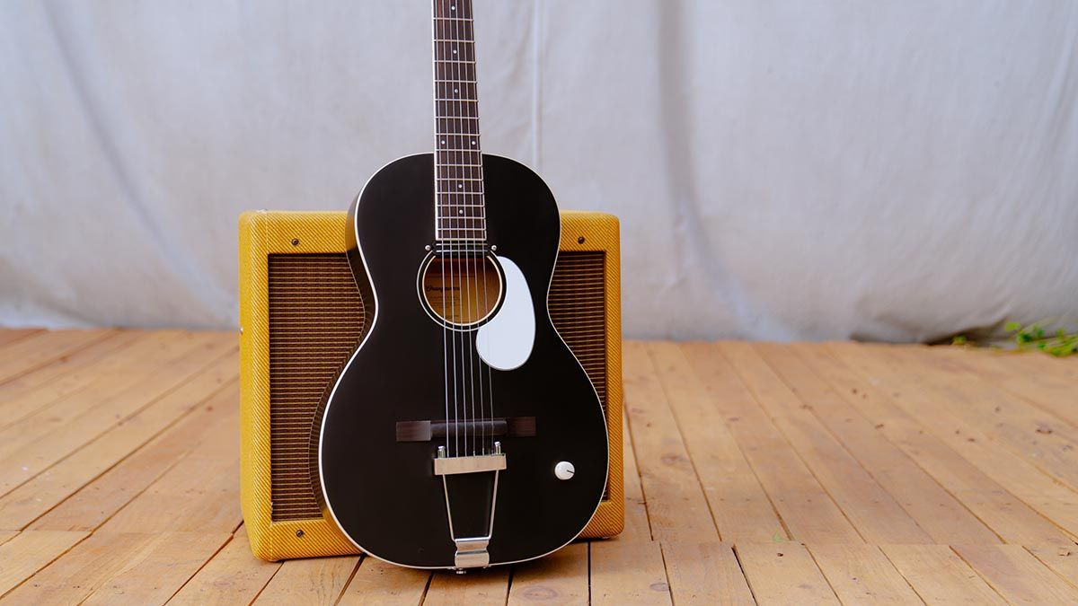 Orangewood Juniper, a parlour-sized acoustic fitted with a rubber bridge and a rail humbucker