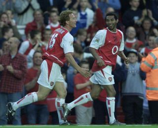 Arsenal’s Jernaine Pennant, right, celebrates his hat-trick against Southampton with Ray Parlour
