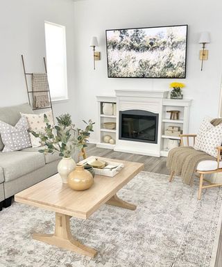 A decorative gold metal ladder in a white modern farmhouse living room