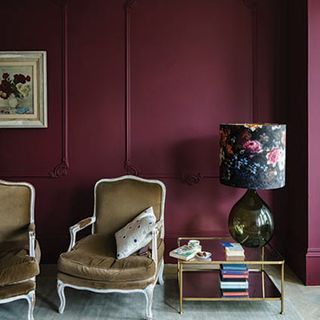 living room with burgundy wall and chair