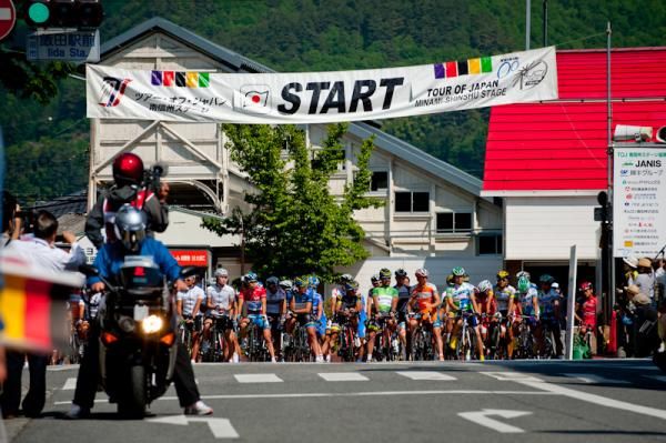 Riders await the race start in front of Iida station